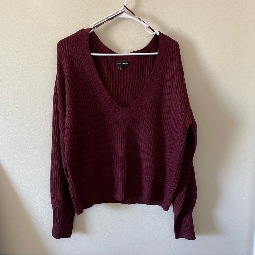 Burgundy, light weight sweater with a deep v-neck, size medium
